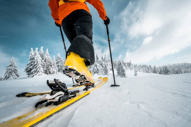 istock Close up on a boot and a ski during ski touring adventure 1464271520