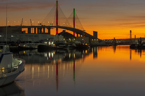 Port of Long Beach, California, United States: Port of Long Beach looking west, including the new Gerald Desmond Bridge, shown at dusk.