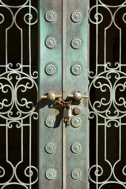 istock Ornate metal doors with patina 1464279702