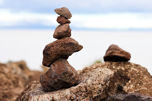 A rock cairn is built at the high point of Incahuasi Island in the middle of Salar De Uyuni, Bolivia