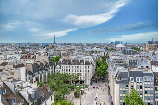 Paris, typical buildings in the Marais, aerial view with the Saint-Eustache church, the Eiffel Tower and the Defense in background