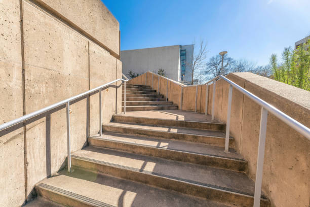 istock Outdoor stairs going inside a building with light blue sky view on a sunny day 1464283437