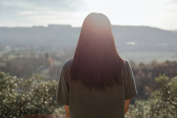 Portrait of a young adult asian woman in nature