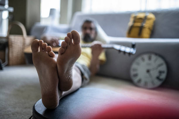 istock Man plays the guitar at home for relaxation. 1464284611