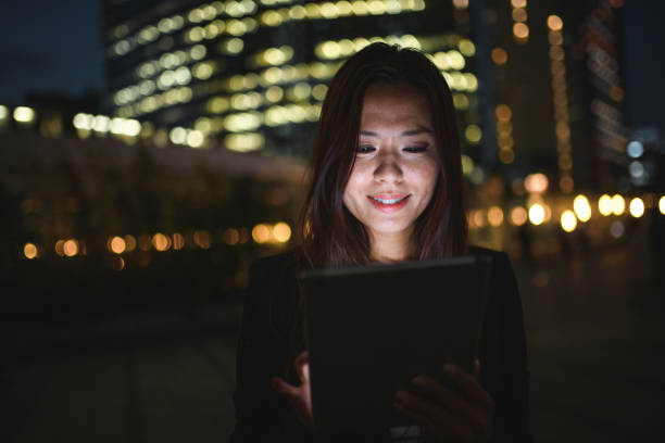 istock Smart Asian Female Entrepreneur Using Wireless Technology In The City 1464284697