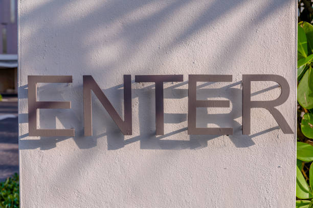 istock Miami, Florida- Painted gray ENTER sign on a concrete wall 1464290188