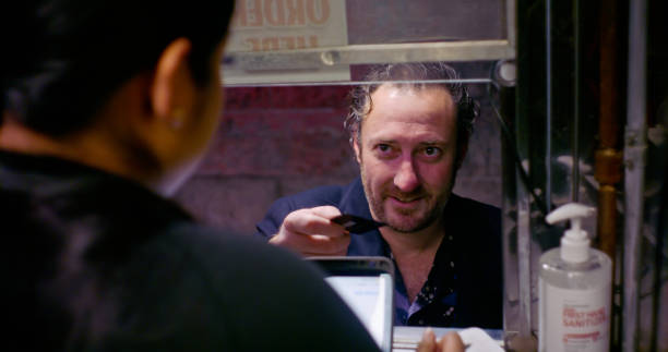 istock Customer Paying For Food at a Taco Truck 1464291378