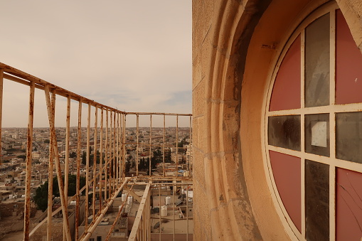 Window and view from the bell tower of the St John the Baptist Church in Madaba, Jordan 2021