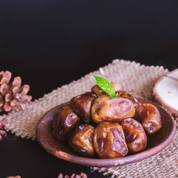 istock Delicious Date Fruit in a bowl. Bowl of dried dates. 1464298624