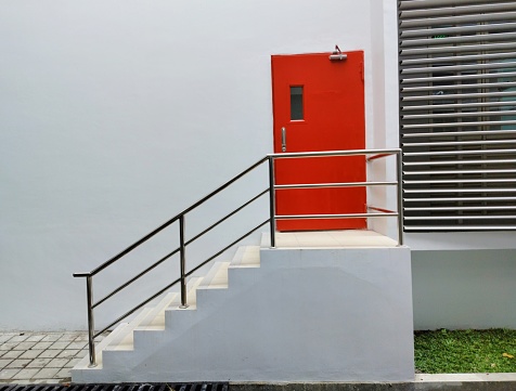 Red emergency exit with stairs