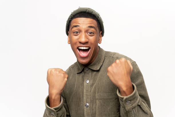 istock Excited overjoyed man shouting making yes gesture, amazed with his victory, triumph. Indoor studio shot isolated on white 1464308730