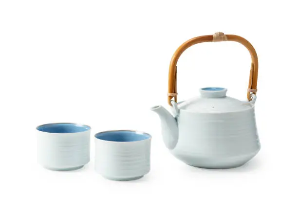 Japanese teacups and teapots placed against a white background. Ceramics. Crafts.