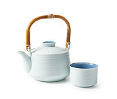 Japanese teacups and teapots placed against a white background.