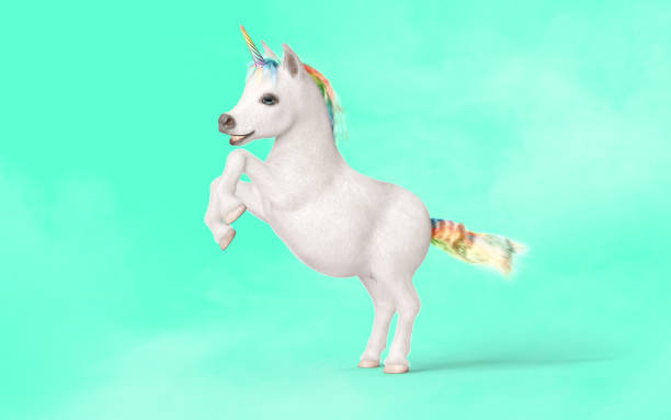 istock White unicorn with rainbow horn isolated on green background. 1464311773