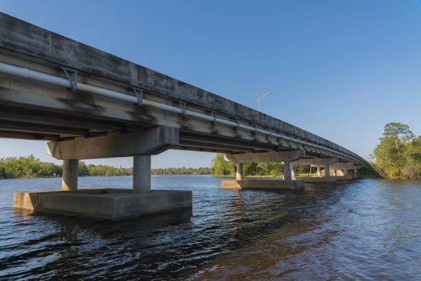 istock Highway bridge over the river against the clear sky in Milton, Florida 1464313527