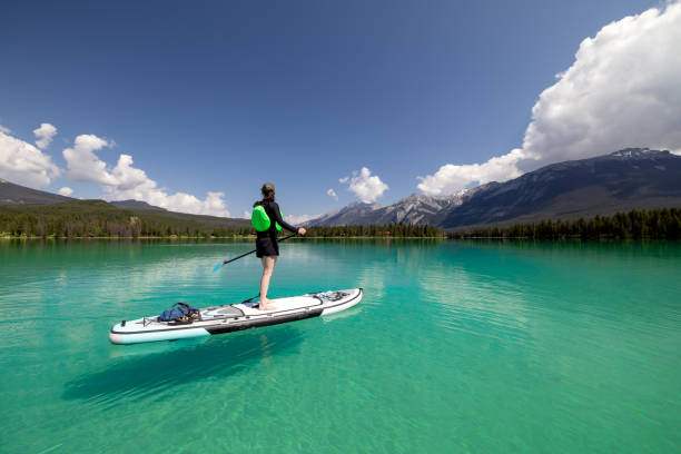 istock Woman Paddleboarding on Edith Lake, Jasper National Park, Alberta 1464313847