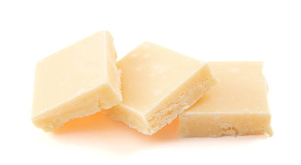 istock Creamy White Chocolate Fudge Isolated on a White Background 1464314403