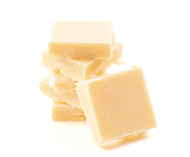 istock Creamy White Chocolate Fudge Isolated on a White Background 1464314415