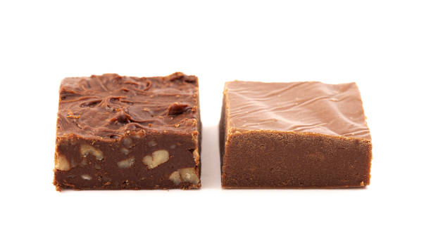 istock Nut or Plain Chocolate Fudge Isolated on a White Background 1464314437