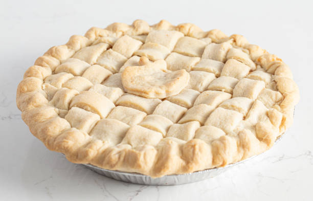 istock Handmade Apple Pie with a Lattice Top Crust on a Kitchen Counter 1464318690