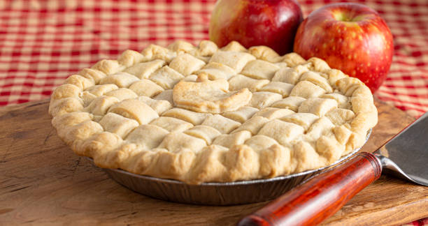 istock Handmade Apple Pie with a Lattice Top Crust on a Kitchen Counter 1464318704