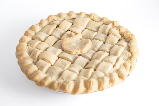 A Handmade Apple Pie with a Lattice Top Crust Isolated on a White Background