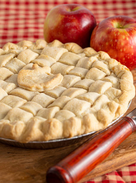 istock Handmade Apple Pie with a Lattice Top Crust on a Kitchen Counter 1464318713