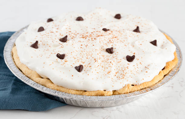 istock Chocolate Cream Pie Topped with Chocolate Chips and Cocoa on Whipped Cream 1464318775
