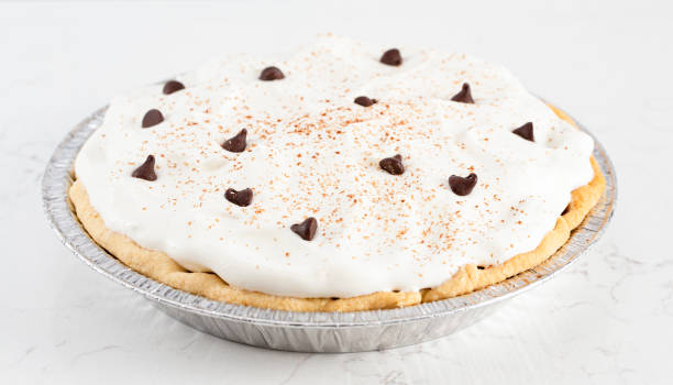 istock Chocolate Cream Pie Topped with Chocolate Chips and Cocoa on Whipped Cream 1464318788