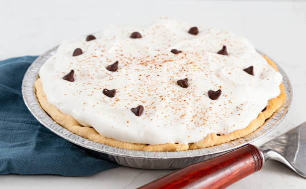 istock Chocolate Cream Pie Topped with Chocolate Chips and Cocoa on Whipped Cream 1464318789