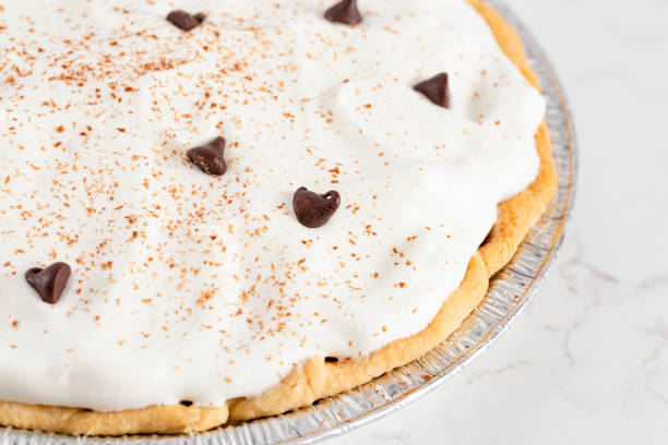 istock Chocolate Cream Pie Topped with Chocolate Chips and Cocoa on Whipped Cream 1464318791