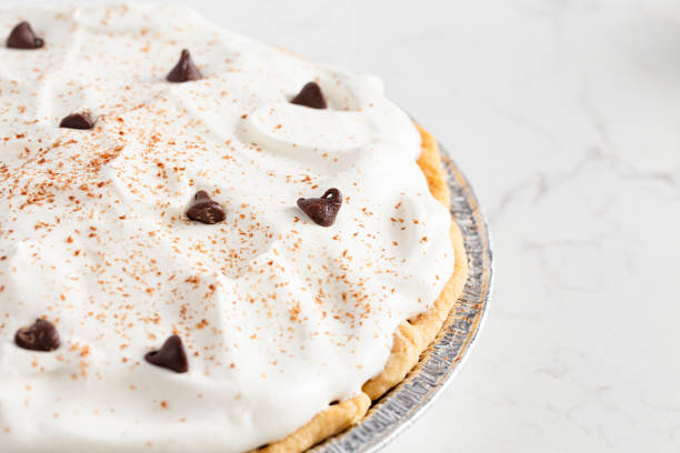 istock Chocolate Cream Pie Topped with Chocolate Chips and Cocoa on Whipped Cream 1464318796