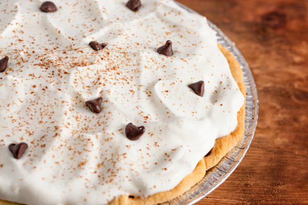 istock Chocolate Cream Pie Topped with Chocolate Chips and Cocoa on Whipped Cream 1464318803