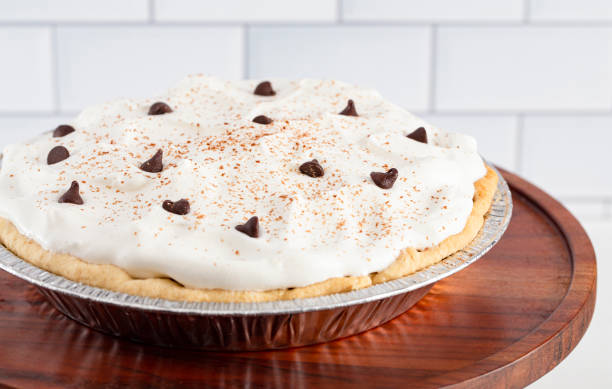 istock Chocolate Cream Pie Topped with Chocolate Chips and Cocoa on Whipped Cream 1464318806
