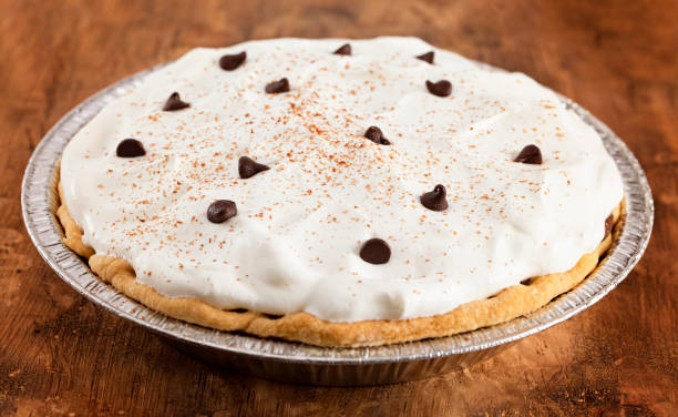 istock Chocolate Cream Pie Topped with Chocolate Chips and Cocoa on Whipped Cream 1464318813