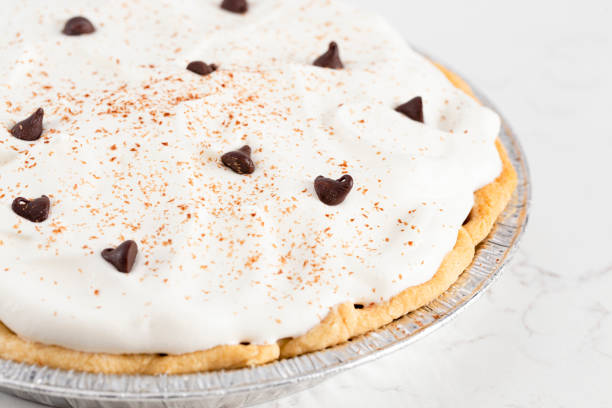 istock Chocolate Cream Pie Topped with Chocolate Chips and Cocoa on Whipped Cream 1464318815