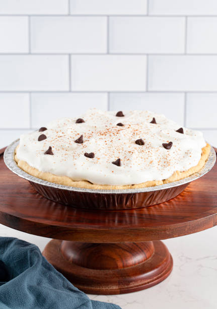 istock Chocolate Cream Pie Topped with Chocolate Chips and Cocoa on Whipped Cream 1464318817