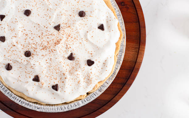 Chocolate Cream Pie Topped with Chocolate Chips and Cocoa on Whipped Cream
