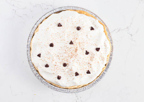 istock Chocolate Cream Pie Topped with Chocolate Chips and Cocoa on Whipped Cream 1464318822