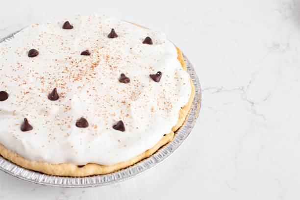 istock Chocolate Cream Pie Topped with Chocolate Chips and Cocoa on Whipped Cream 1464318827