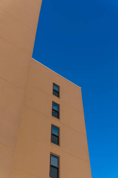 istock Multi-storey building with painted brown wall and single-hung windows in Destin, Florida 1464319236