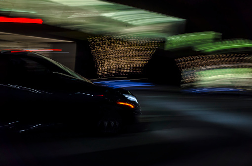 Blurred motion:  Black car in the night at Toronto