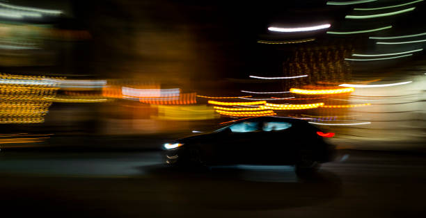 istock CAR AT NIGHT IN MOTION BLUR 1464328194