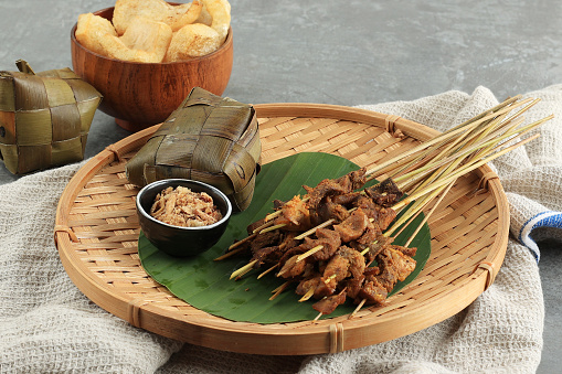 Sate Padang. Spicy Beef Satay from Padang, West Sumatra. Served with Spicy Curry Sauce and Katupat Rice Cake