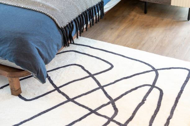 istock Modern graphic rug on the floor in a bedroom. 1464333164