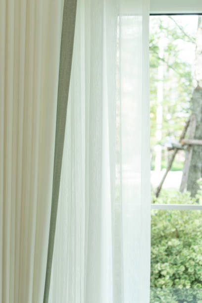istock White curtain at window in living room. 1464333783