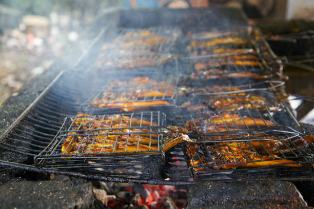 Smoked chicken wings preparation at local stall