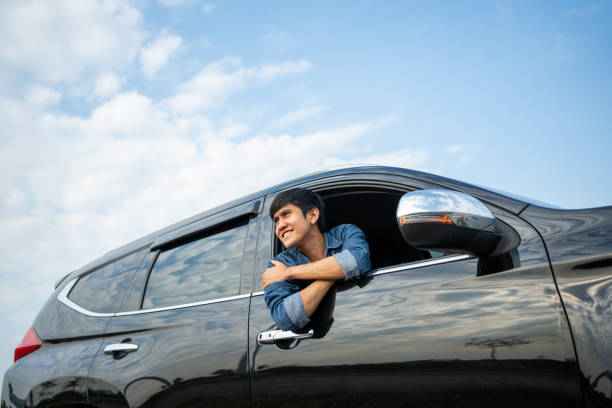 istock Young Asian Man in Car 1464336376