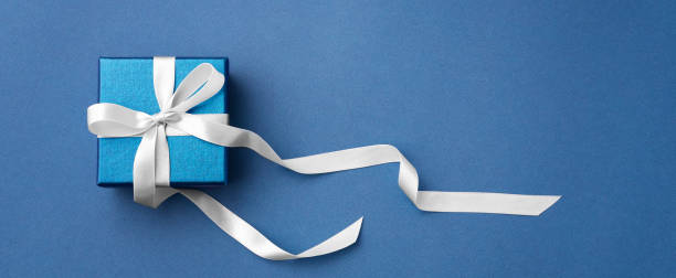 istock Blue gift box with white bow ribbon, father day background 1464339067