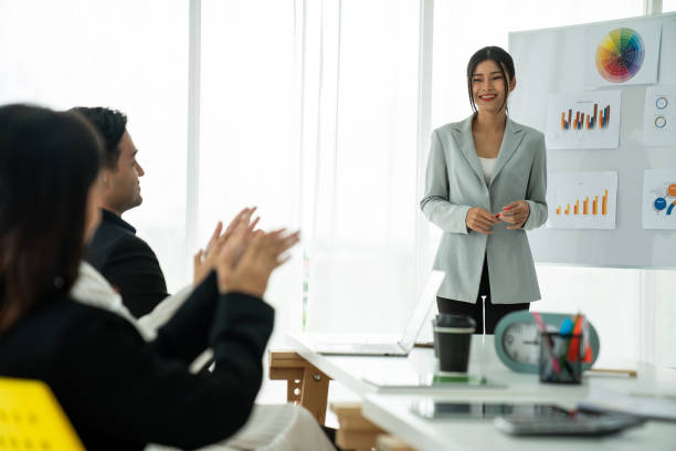 istock Businesswoman proficiently present work project receive celebrations from team . Corporate business team collaboration concept . 1464344753